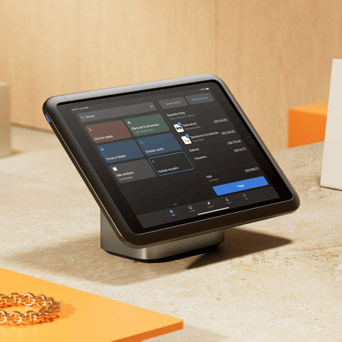 Una tablet de POS en un mostrador de una tienda física ejecutando Shopify POS en la pantalla.