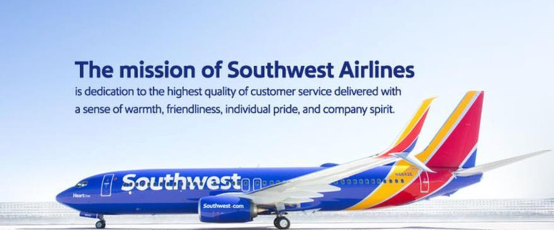 Southwest airplane with mission text overlaid on sky above plane.