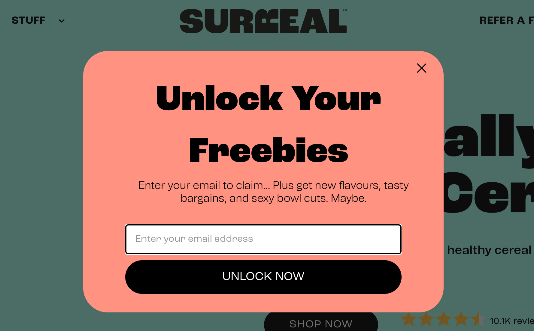 Pink website popup from Surreal with a built-in form and black button that says “unlock now”.