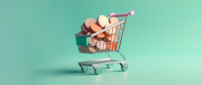 en handlevogn med store mynter i den: kundevervingskostnader etter bransje